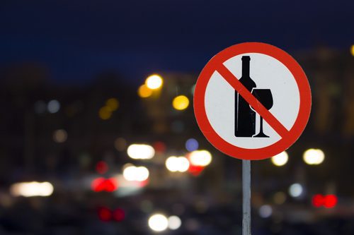 no alcohol street sign at night - alcohol awareness month