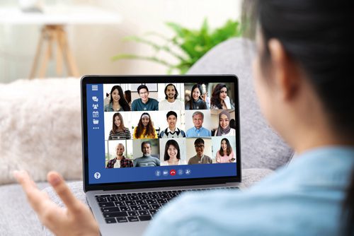 woman at home on laptop doing zoom meeting - addiction recovery - social distancing