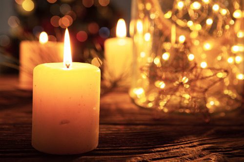 candles and Christmas lights - holiday season