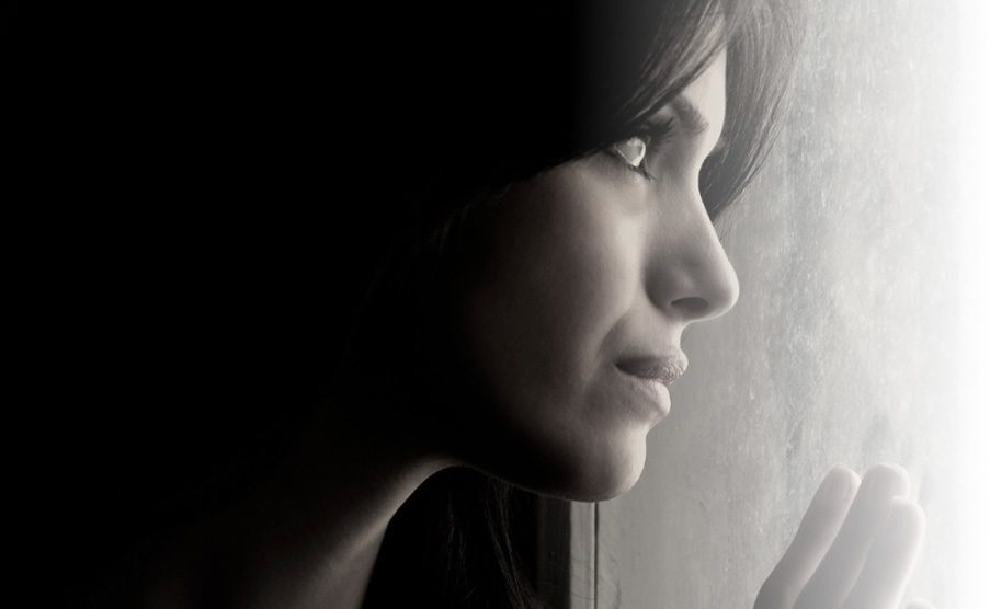 woman sad - depressed woman - looking out the window - depression - anxiety - addiction recovery in Mesa - mental health treatment in Arizona - rehab in Mesa - therapy in Mesa