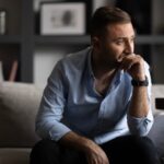 Person looking out at distance thinking