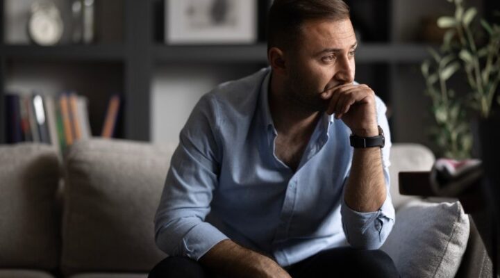 Person looking out at distance thinking