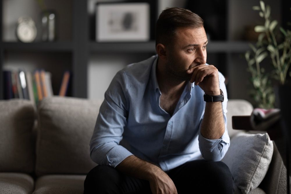 Person looking out at distance thinking